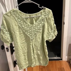 Woman’s green shirt